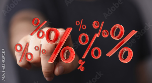 Hand reaching towards red p...
