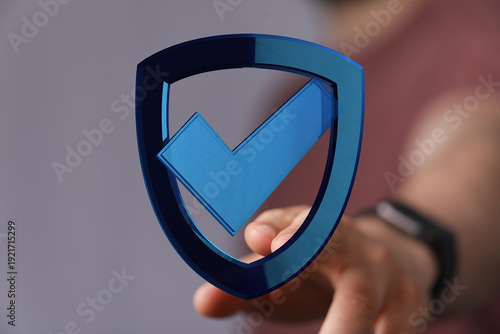 A person's hand holding a d...