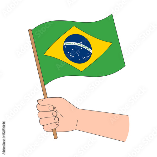 Hand holding Brazilian flag on a wooden stick symbolizing patriotism and national pride strongly