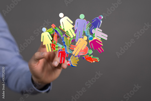 Hand holding digital people...