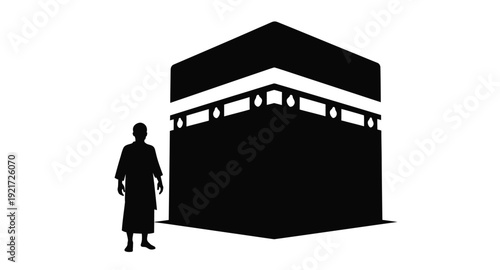 The kaaba in mecca with a person stark black silhouette