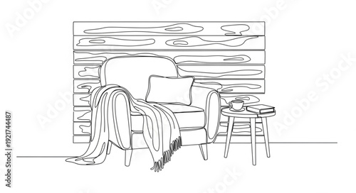Cozy armchair with blanket and side table sketch.