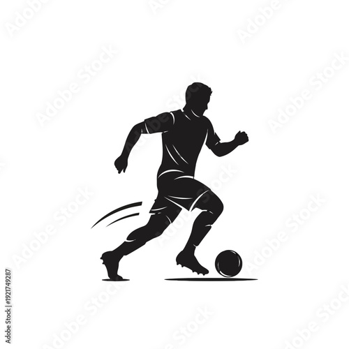 Silhouette of a Soccer Player in Action Kicking a Ball on the Field.