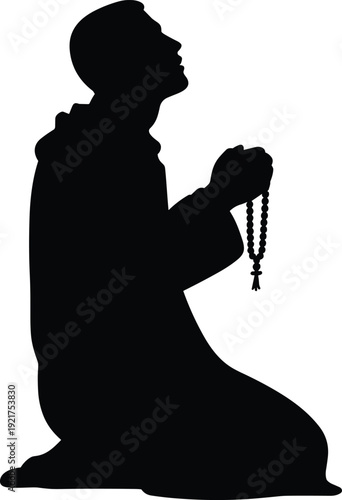 Silhouette of a person kneeling and praying with a rosary in hand