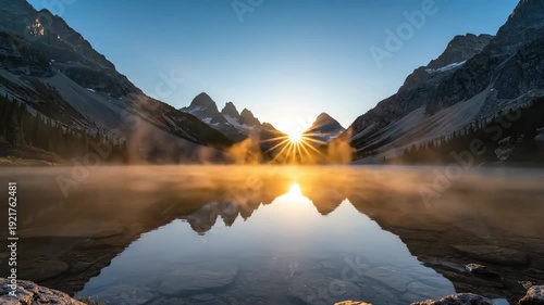 Sunrise over tranquil lake reflecting mountain peaks, mist rising from water, creating a serene atmosphere in the early morning light