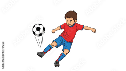 Energetic young boy in a red shirt and blue shorts kicks a soccer ball high into the air, demonstrating his athletic passion for the popular sport.