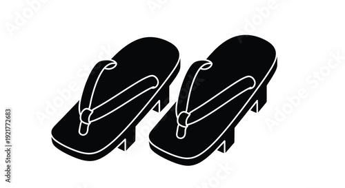Two black flip flops resting diagonally a striking black silhouette