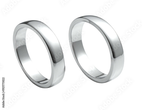 Two elegant silver wedding rings symbolizing love and commitment side by side.