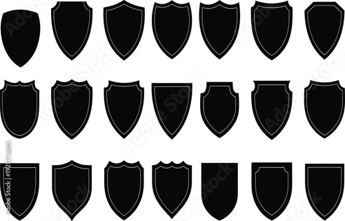 Set of black shield silhouettes and heraldic crest icons isolated on white background for logo design security emblems protection symbols and medieval coat of arms