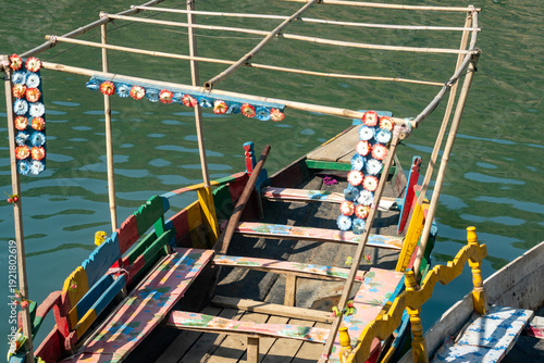 Close-up of a vibrantly decorated boat on calm waters