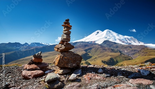 rock stacking mountain balance cairns mark trail with elbrus peak backdrop in daytime for navigation