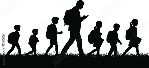 Silhouette of a group of people walking in a line with backpacks on a grassy field