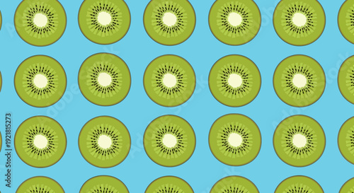 Vibrant kiwi slices on bright blue background for fresh food concepts