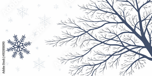 A delicate snowflake and a barren tree branch in a winter scene