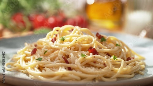 Spaghetti Carbonara Served with Pancetta on a Plate - Presentation of the Main Course in a Sunny Italian Restaurant, Packshot, Dolly out