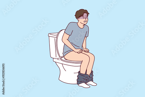 Man sitting on toilet experiencing severe pain and difficulty due to hemorrhoids or constipation. Concept of proctology health issues and digestive discomfort.