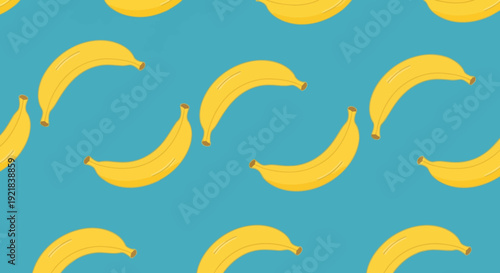 Vibrant yellow bananas on blue background seamless pattern