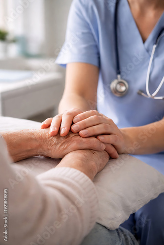 Nurse holding patients hand in hospital room hand holding