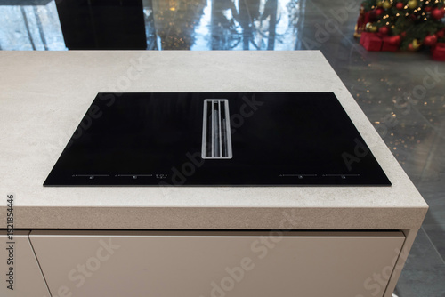 Принти на полотні Black induction hob with integrated extractor on kitchen island