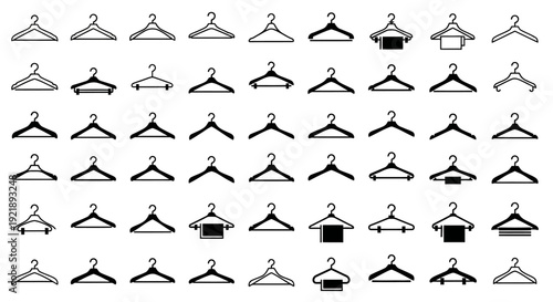 Collection of various black and white clothing hangers on a white background for organization and storage needs