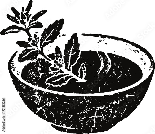 Herbal tea in a rustic cup with steam and fresh leaves, natural healthy beverage concept