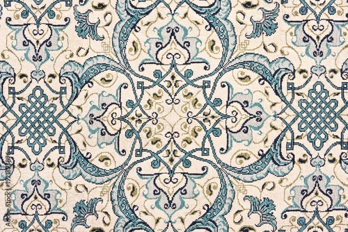 Elegant blue and beige floral pattern on vintage carpet