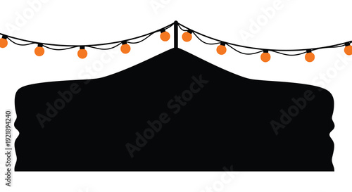 Festive string lights hang above a dark triangular shape a silhouette