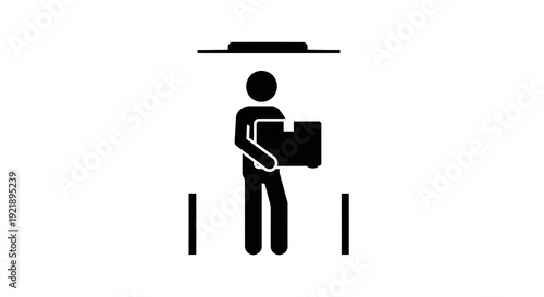 Person holding a briefcase standing under a light.