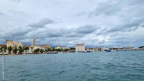 Riva promenade with Diocletian palace and old town in Split, Croatia on the Adriatic sea, dramatic sky