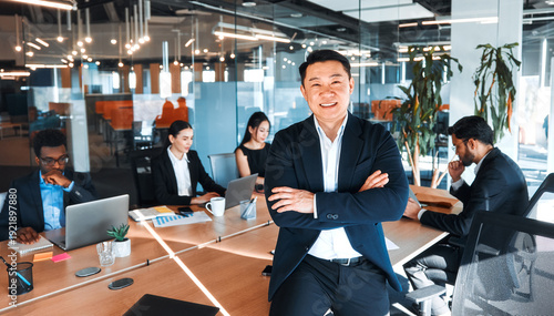 Bild auf Leinwand Confident Business Executive Leading Diverse Team in Office