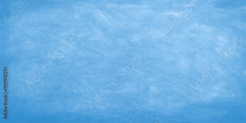 Abstract blue grunge paper texture featuring a cold winter sky with frozen white cloud patterns and a light textured ice surface