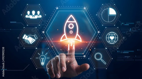 Hand touching digital rocket launch icon in futuristic business technology interface with innovation and growth concepts glowing blue