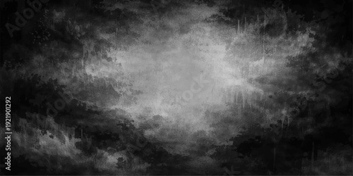 An abstract black and white smoke pattern creates a dark textured backdrop of swirling steam and mist like a motion storm cloud in a night sky