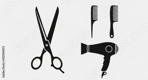 Hairdressing tools including scissors comb and hairdryer.