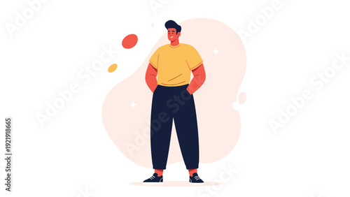 Young man in a yellow t-shirt and dark trousers standing confidently with his hands in his pockets against a soft abstract background.