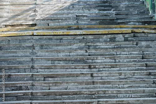 Worn stone steps leading up through sunshine and shadows