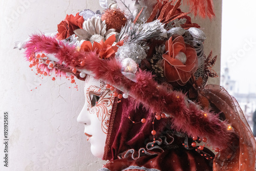 Elegant Venetian Masked Woman in Red and Silver Traditional Carnival Costume
