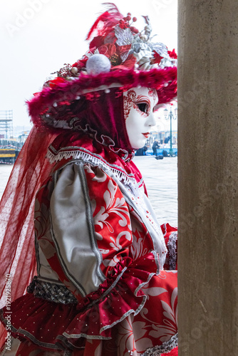 Elegant Venetian Masked Woman in Red and Silver Traditional Carnival Costume