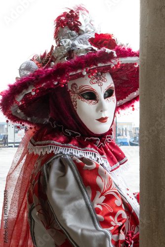 Elegant Venetian Masked Woman in Red and Silver Traditional Carnival Costume