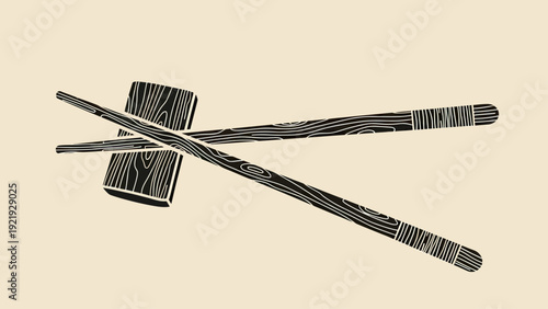 Black wooden chopsticks and a block, with wood grain detail, on a beige background