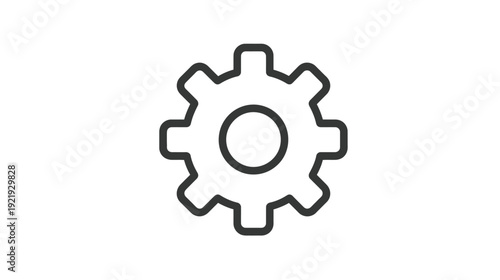 A grayscale icon of a gear with teeth around the circumference and a central circular hole