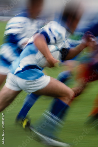 Obraz na płótnie Rugby player sprinting with the ball toward the try line