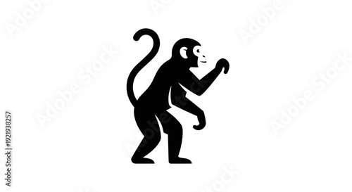 Monkey silhouette standing on two legs.