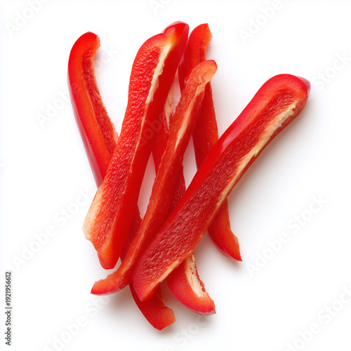 three cut strips of red pepper in a small bunch, white background