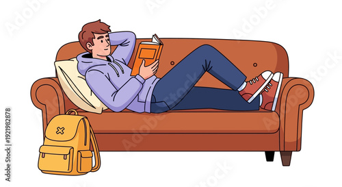 A young man relaxing on a couch, engrossed in reading a book, in a casual living room setting, viewed from the side.
