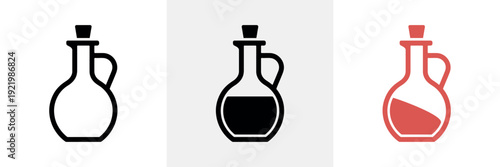 Three bottles with different colored liquids in a row