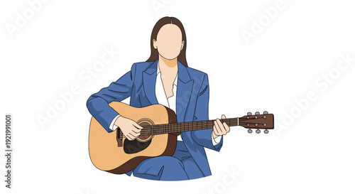 A beautiful young woman wearing a sleek blue suit is sitting comfortably while intently playing an acoustic guitar on a white background.