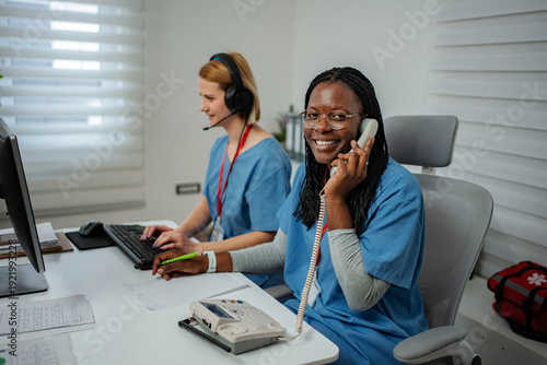 Wallpaper Mural Medical dispatchers working in busy emergency call center Torontodigital.ca