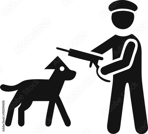 A person holding a long gun standing next to a domestic dog