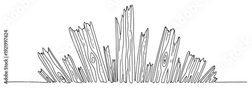 Broken wooden fence planks with splintered wood debris and jagged edges